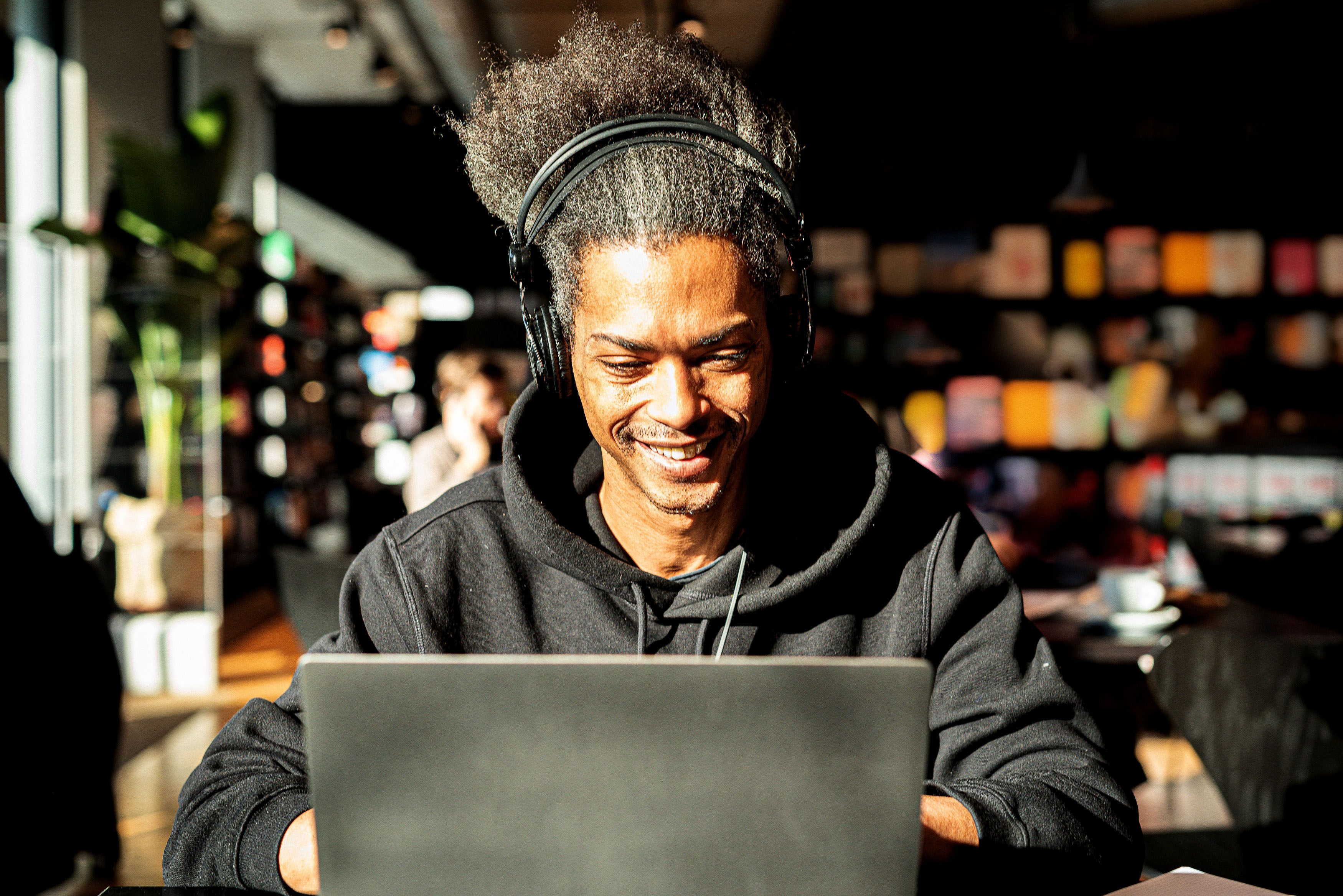Man smiling looking into laptop